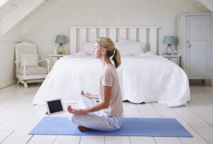 4 Pinterest Trends You Should Try Now, woman meditating in room