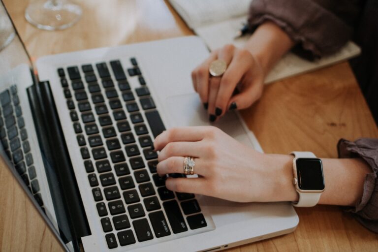 A woman browsing through social media metrics and reports