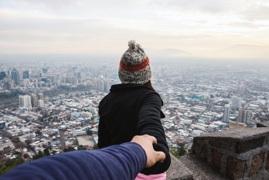 Woman leading her follower across the city