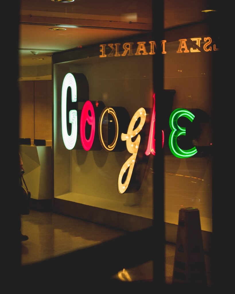 neon google sign through window